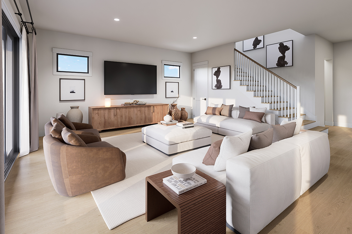 Warm neutral living room with wood floor and a dark sofa